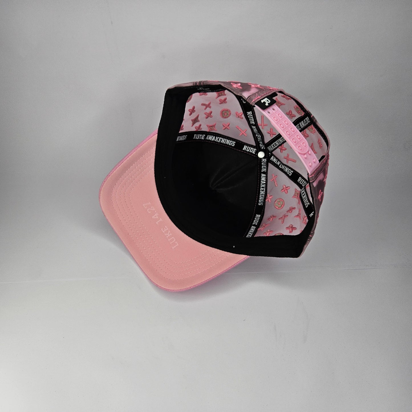 GORRA "RUDE AWAKENINGS" LA-LA-LA PINK